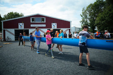 Recreational rowers, launching a touring boat at training